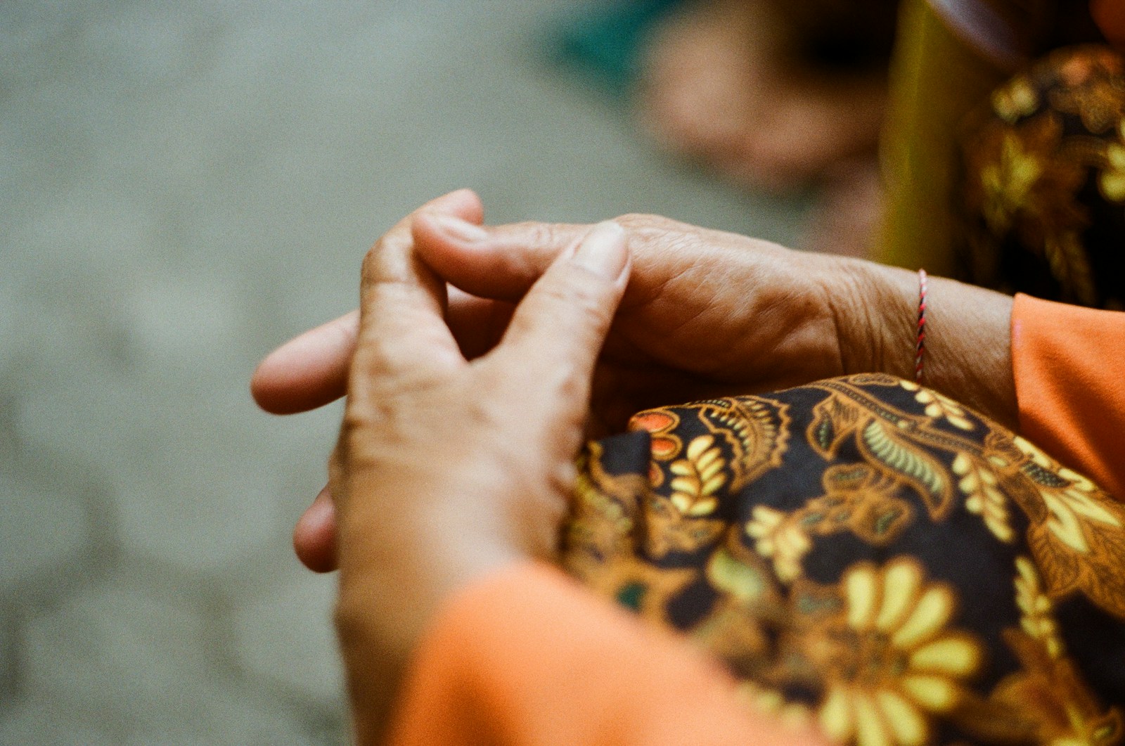 person wearing gold and black ring
